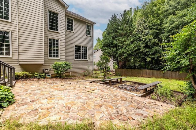 view of patio featuring fence