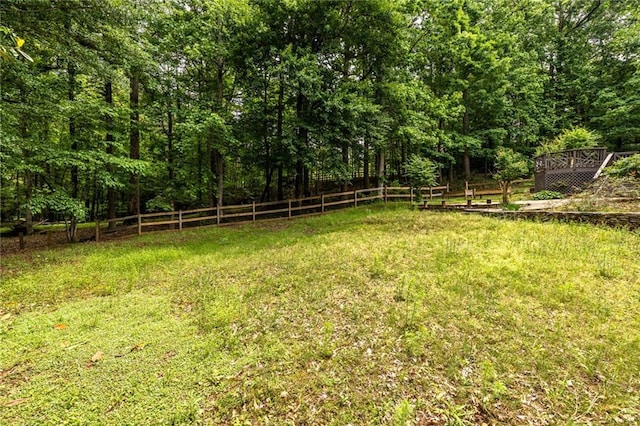 view of yard with a wooded view