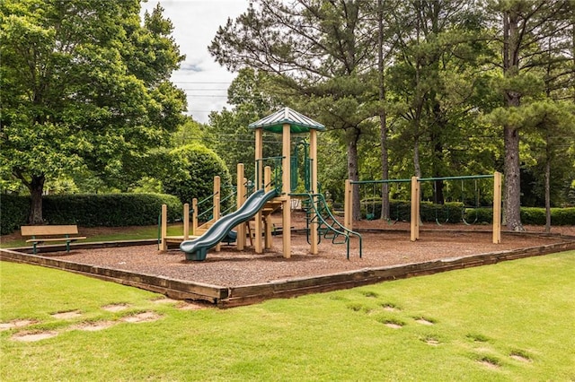 community jungle gym featuring a yard