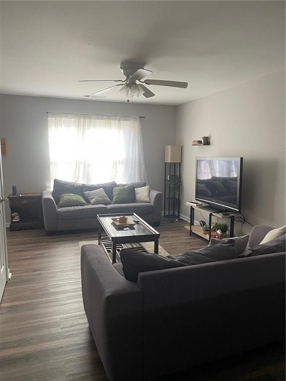 living area featuring ceiling fan and wood finished floors