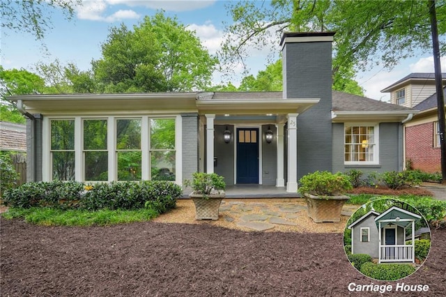 25 Standish Ave NW, Atlanta, GA 30309 - view of front of property with a chimney, brick siding, and a porch