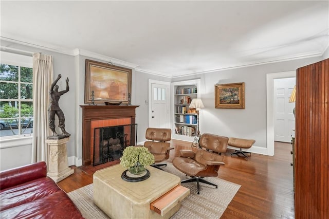 25 Standish Ave NW, Atlanta, GA 30309 - living area with wood finished floors, ornamental molding, a fireplace, baseboards, and built in features