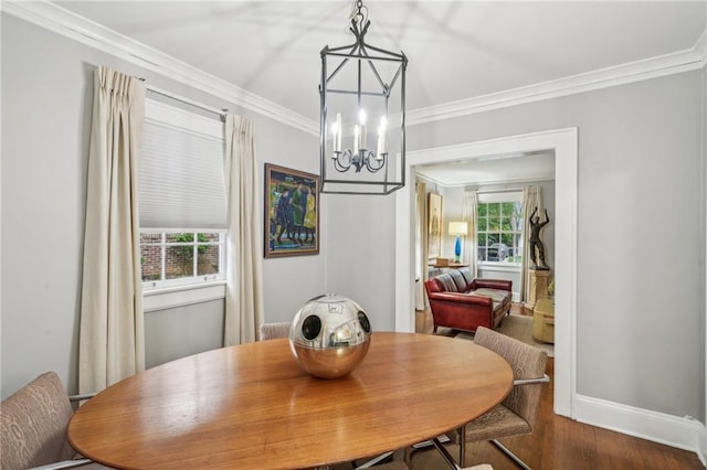 25 Standish Ave NW, Atlanta, GA 30309 - dining area featuring ornamental molding, a chandelier, dark wood-style flooring, and baseboards