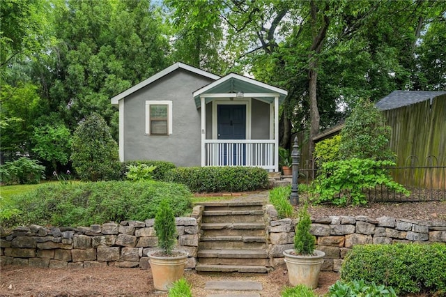 25 Standish Ave NW, Atlanta, GA 30309 - view of front facade with fence and stucco siding