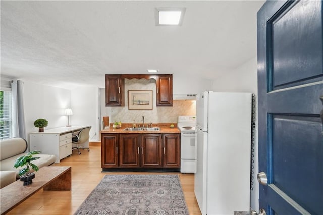 25 Standish Ave NW, Atlanta, GA 30309 - kitchen featuring white appliances, a sink, light wood-type flooring, a desk, and ventilation hood