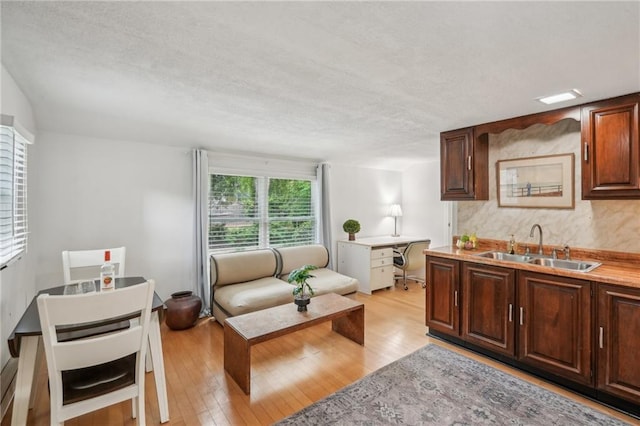 25 Standish Ave NW, Atlanta, GA 30309 - living room with light wood-type flooring and a textured ceiling