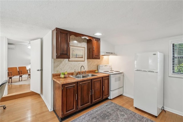 25 Standish Ave NW, Atlanta, GA 30309 - kitchen featuring white appliances, a sink, range hood, light wood-style floors, and a wall unit AC
