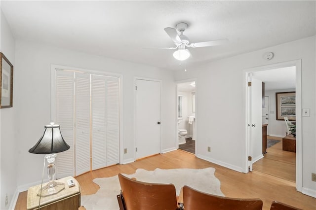25 Standish Ave NW, Atlanta, GA 30309 - living area with light wood-type flooring, a ceiling fan, and baseboards