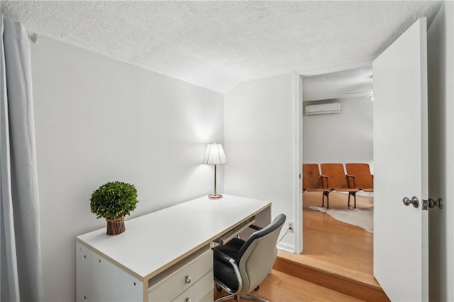 25 Standish Ave NW, Atlanta, GA 30309 - home office featuring light wood finished floors, a textured ceiling, and a wall mounted AC