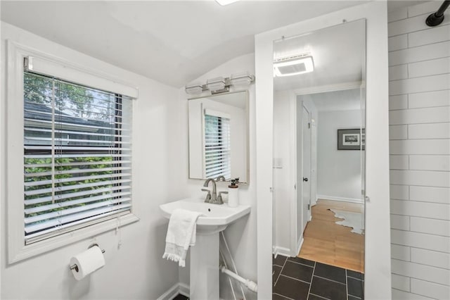 25 Standish Ave NW, Atlanta, GA 30309 - bathroom with vaulted ceiling and baseboards