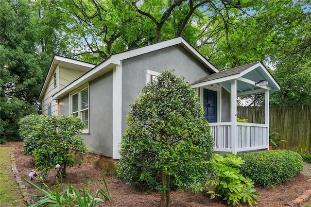 25 Standish Ave NW, Atlanta, GA 30309 - view of property exterior featuring stucco siding and fence
