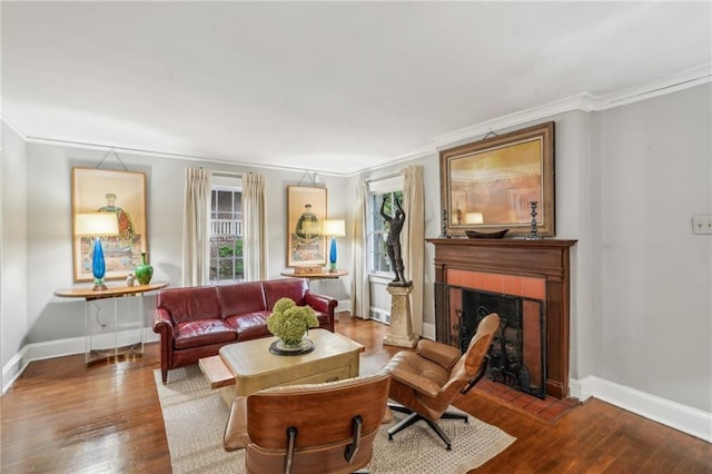 25 Standish Ave NW, Atlanta, GA 30309 - living area with wood finished floors, crown molding, a tiled fireplace, and baseboards