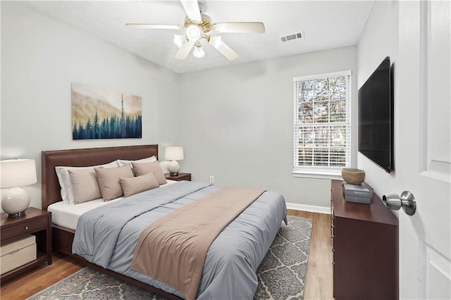 bedroom featuring ceiling fan and hardwood / wood-style flooring