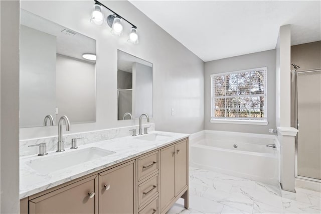 bathroom featuring shower with separate bathtub and vanity