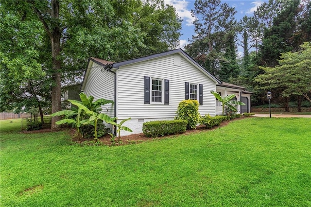 3833 Paddington Trl, Rex, GA 30273 - view of home's exterior featuring crawl space, a garage, a yard, and driveway