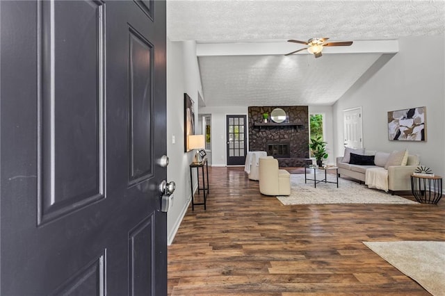 3833 Paddington Trl, Rex, GA 30273 - entryway featuring wood finished floors, a textured ceiling, ceiling fan, and a fireplace