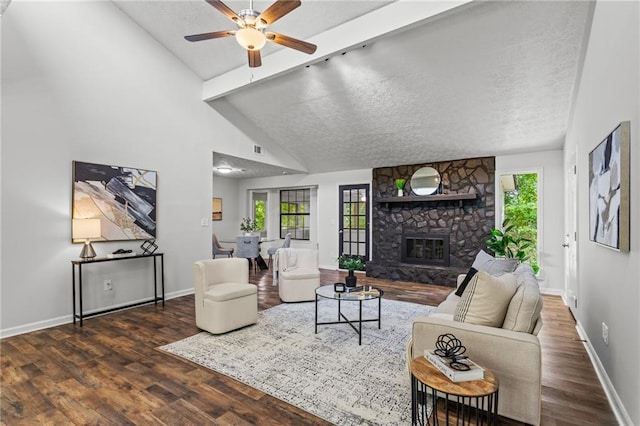 3833 Paddington Trl, Rex, GA 30273 - living room featuring wood finished floors, ceiling fan, a fireplace, and a textured ceiling