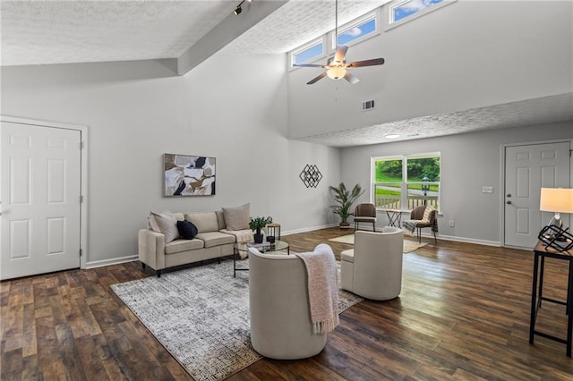 3833 Paddington Trl, Rex, GA 30273 - living room featuring a ceiling fan, wood finished floors, high vaulted ceiling, and a textured ceiling