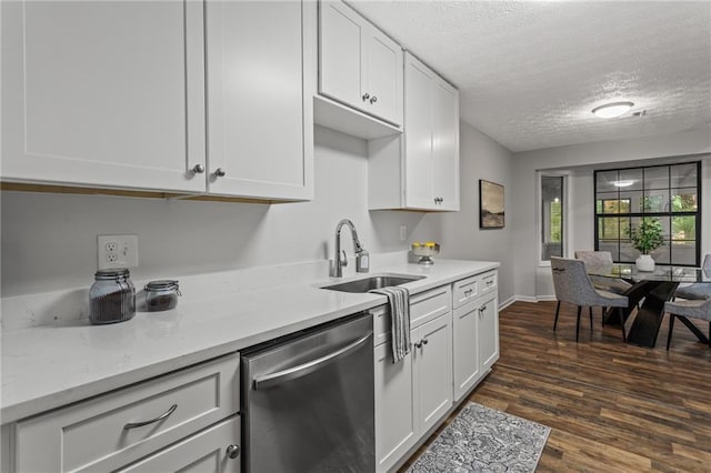 3833 Paddington Trl, Rex, GA 30273 - kitchen featuring stainless steel dishwasher, a textured ceiling, white cabinetry, and dark wood-style flooring