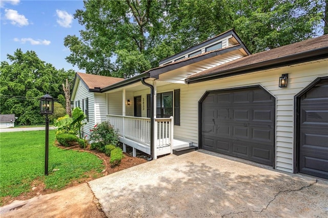 3833 Paddington Trl, Rex, GA 30273 - view of front of property with a porch, driveway, a garage, and a front yard