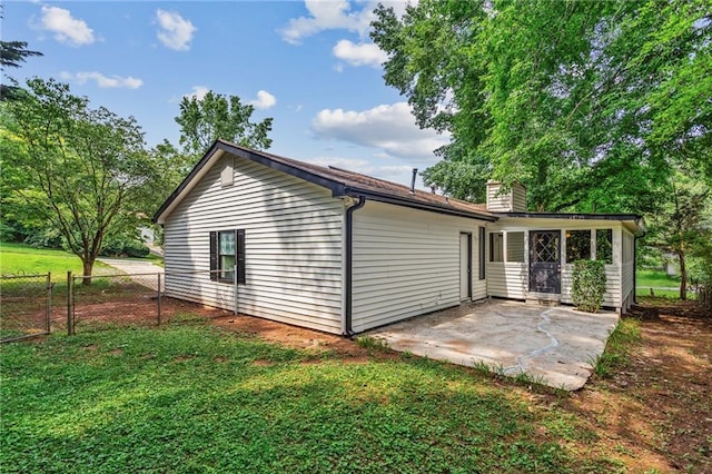 3833 Paddington Trl, Rex, GA 30273 - rear view of property featuring a patio area and a chimney