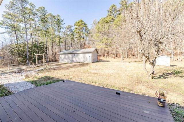 deck featuring a lawn and a storage unit