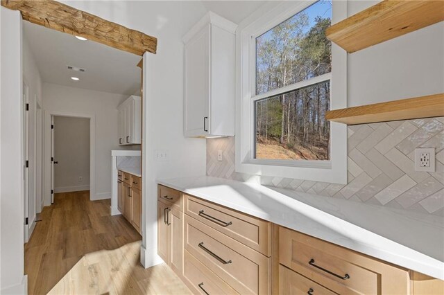 6371 Falcon Ln, Gainesville, GA 30506 - kitchen with light countertops, stainless steel microwave, high vaulted ceiling, a sink, and light wood-style flooring