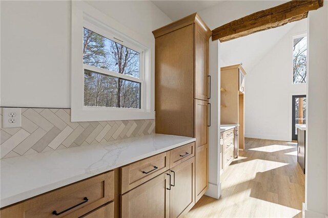 6371 Falcon Ln, Gainesville, GA 30506 - kitchen featuring light countertops, french doors, tasteful backsplash, light wood-type flooring, and stainless steel microwave