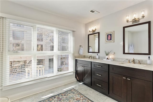 bathroom featuring vanity, a wealth of natural light, and tile patterned floors