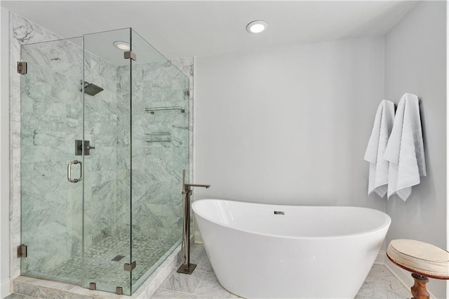 bathroom with tile patterned floors and plus walk in shower