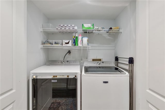 laundry room featuring independent washer and dryer