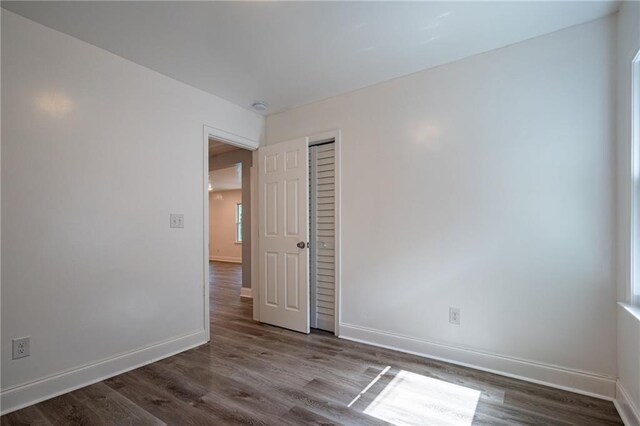 spare room with hardwood / wood-style floors