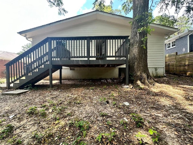 back of house featuring a deck