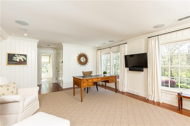 office with visible vents, crown molding, and wood finished floors