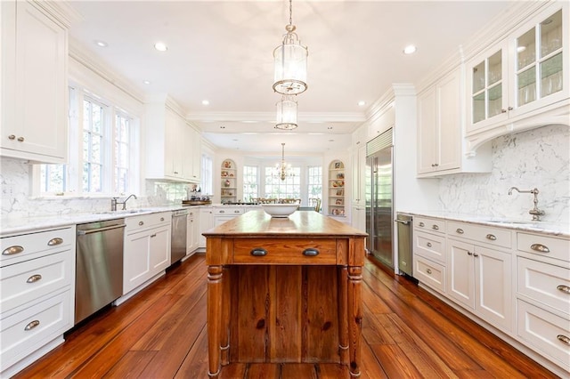 kitchen featuring white cabinetry, appliances with stainless steel finishes, and a sink