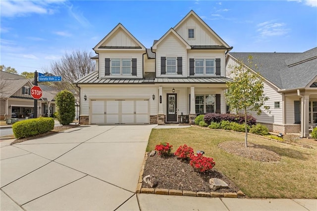 340 Marietta Walk Ln, Marietta, GA 30064 - view of front of house with concrete driveway, a front lawn, board and batten siding, a porch, and a garage