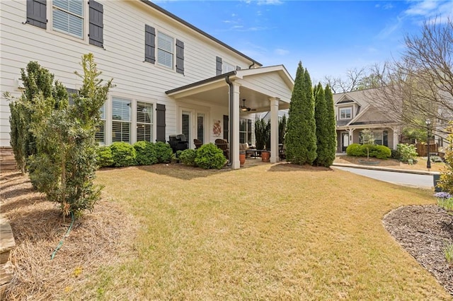 340 Marietta Walk Ln, Marietta, GA 30064 - living room with dark wood-style flooring, a ceiling fan, a glass covered fireplace, ornamental molding, and recessed lighting
