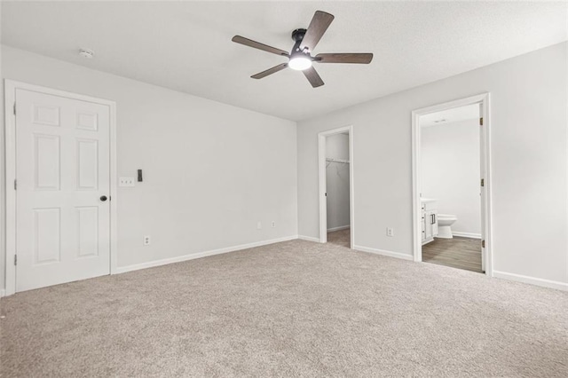 3454 Carriage Chase Rd, Atlanta, GA 30349 - unfurnished bedroom with carpet floors, a spacious closet, baseboards, ensuite bath, and a closet