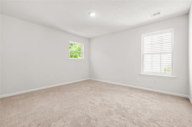3454 Carriage Chase Rd, Atlanta, GA 30349 - carpeted spare room with a textured ceiling, baseboards, and recessed lighting