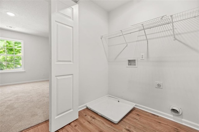 3454 Carriage Chase Rd, Atlanta, GA 30349 - laundry area featuring hookup for a washing machine, electric dryer hookup, baseboards, light wood-type flooring, and gas dryer hookup