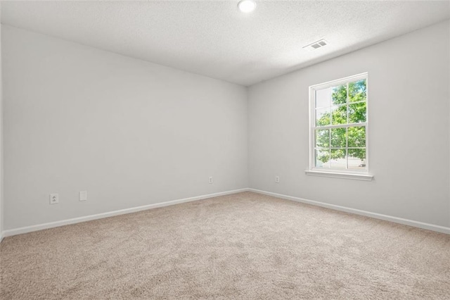 3454 Carriage Chase Rd, Atlanta, GA 30349 - carpeted empty room with a textured ceiling and baseboards