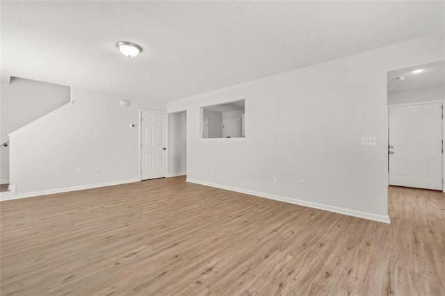 3454 Carriage Chase Rd, Atlanta, GA 30349 - unfurnished living room with light wood-type flooring and baseboards