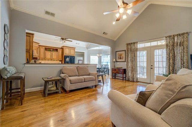 living area featuring a ceiling fan, high vaulted ceiling, french doors, crown molding, and light wood-type flooring