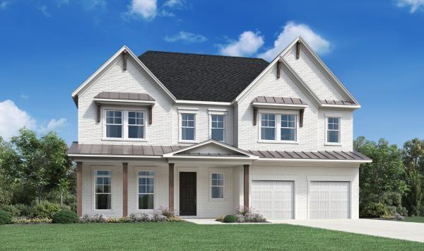 view of front of house featuring a garage and a front yard