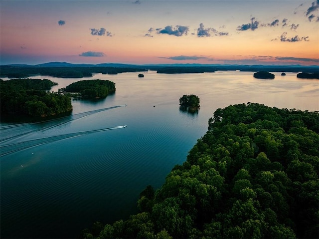 aerial view at dusk with a water view