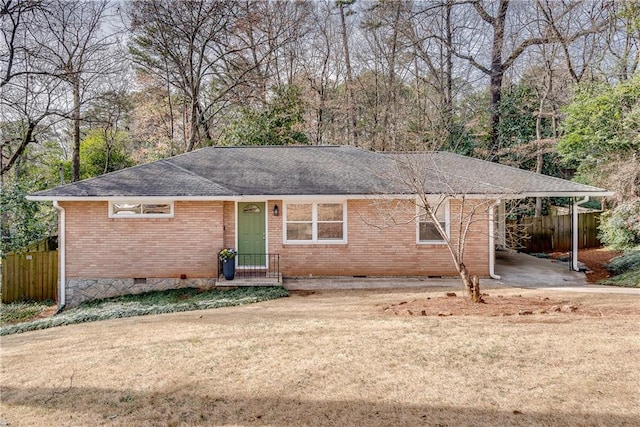 ranch-style house featuring a front lawn and a carport