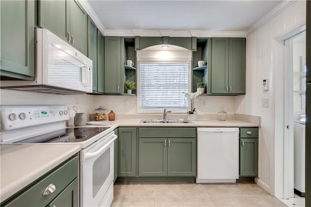 kitchen with green cabinetry, ornamental molding, sink, and white appliances