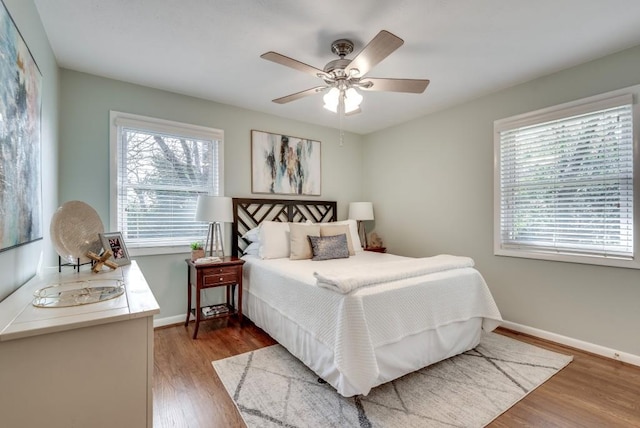 bedroom featuring ceiling fan and hardwood / wood-style flooring