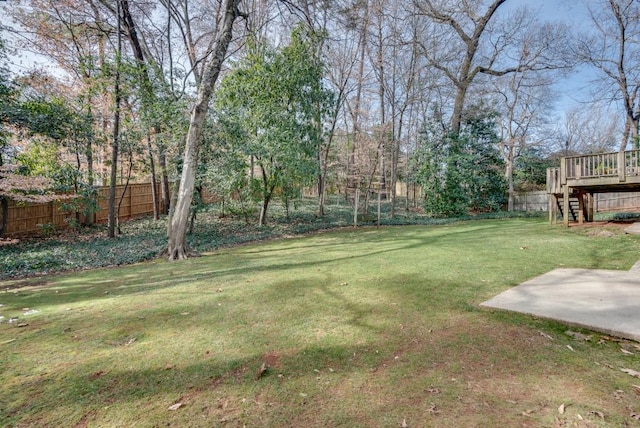 view of yard featuring a wooden deck