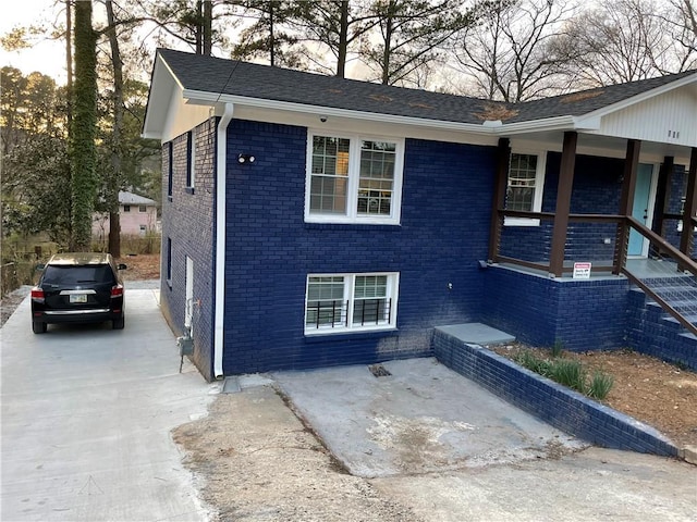 view of side of home featuring brick siding